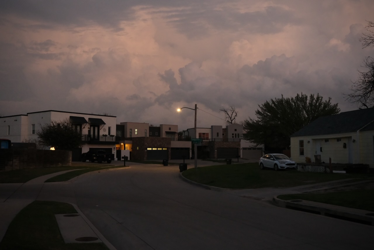Gentrified street at dusk under storm clouds, Fort Worth
