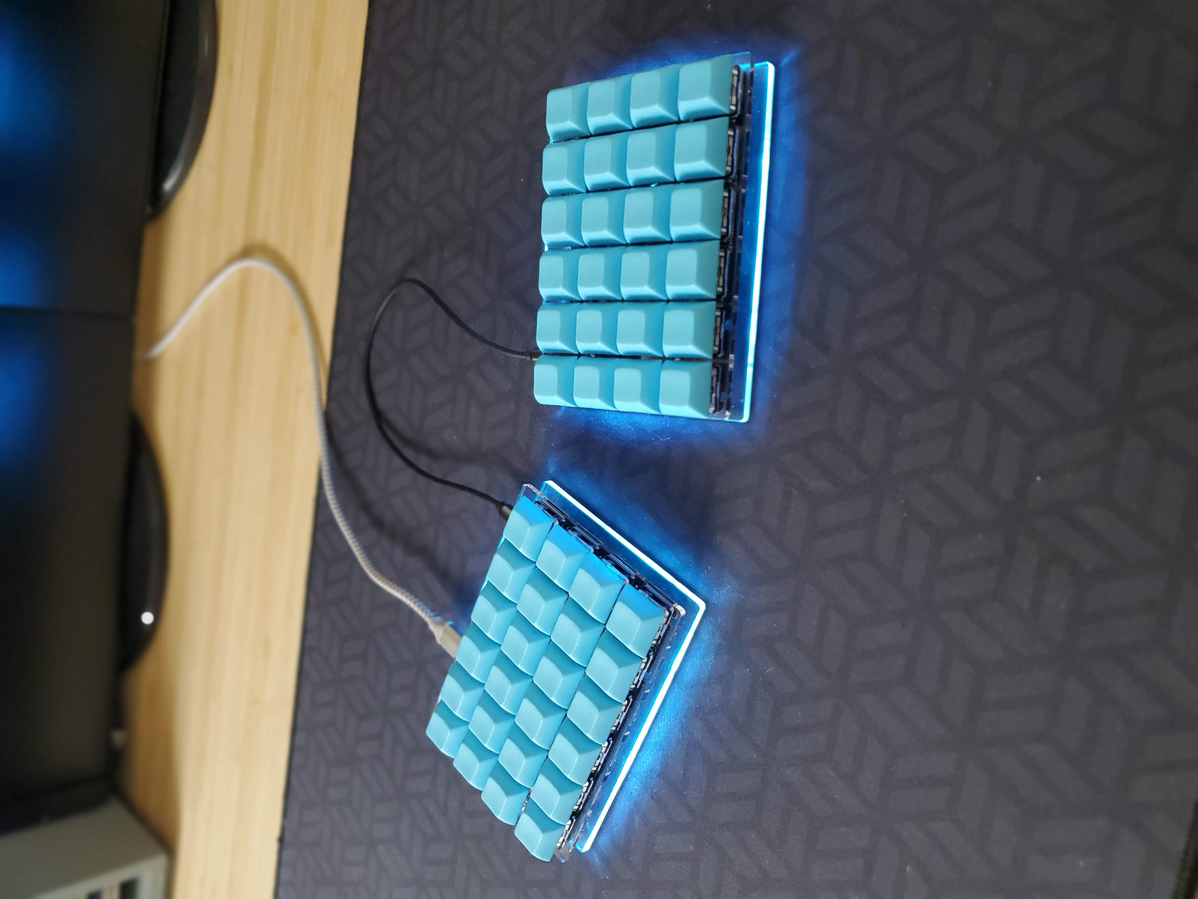  blue computer keyboard with only 40% of the normal keys