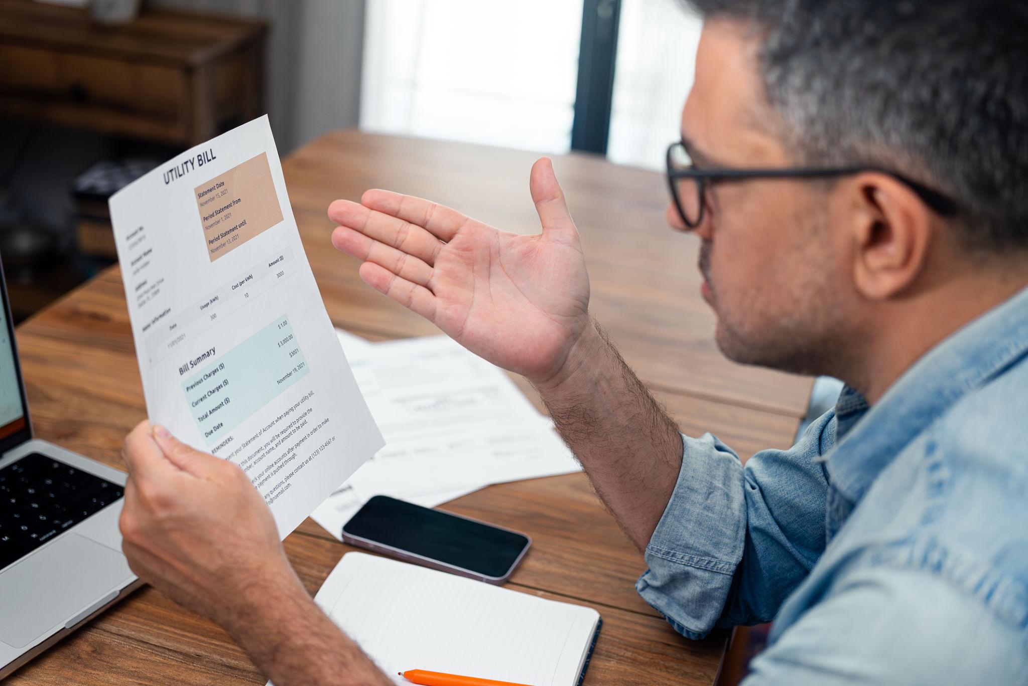 Tenant reading their reduced energy bill after joining Cryptotricity through their housing association