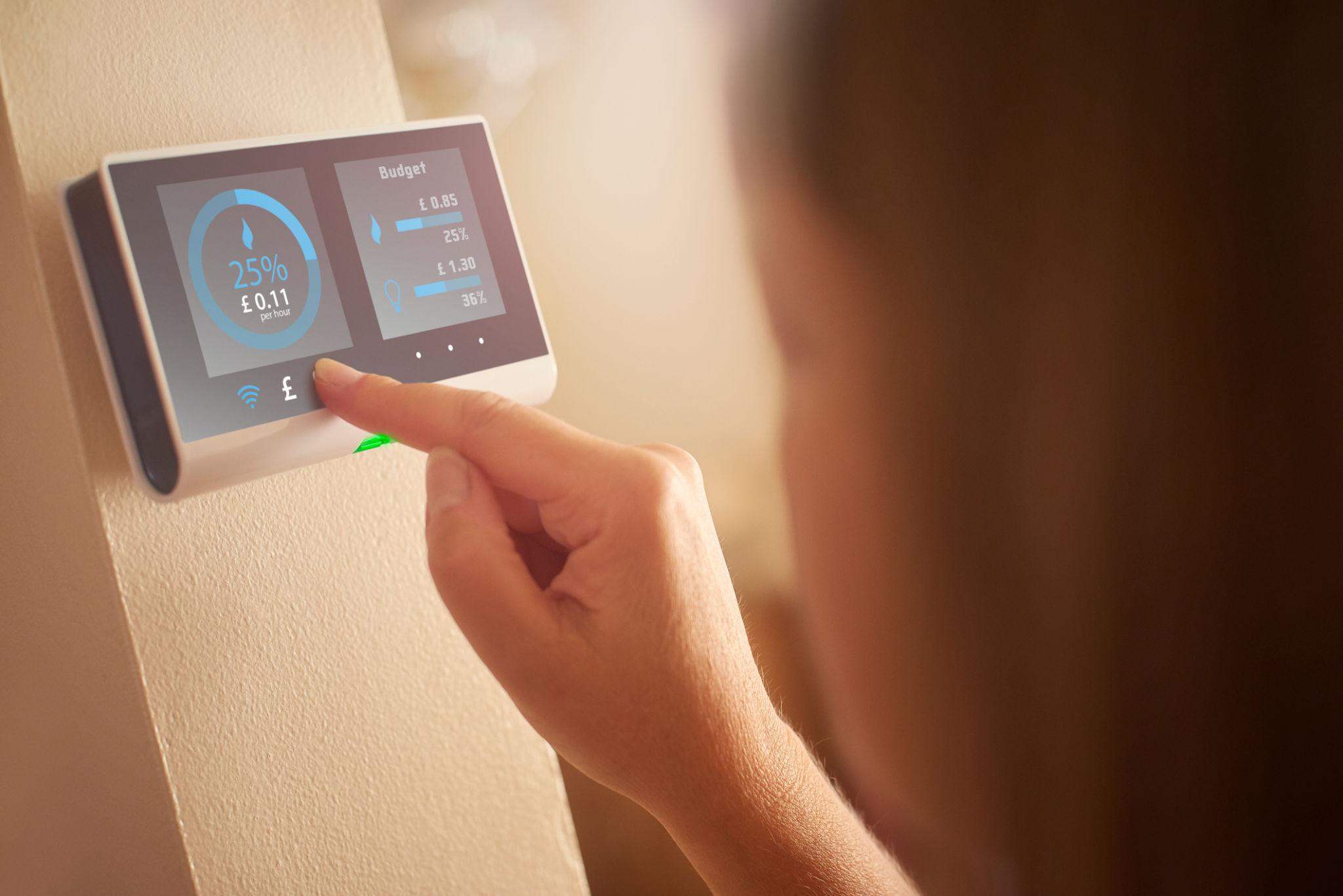 Pressing the smart meter button to connect to Cryptotricity DSR platform
