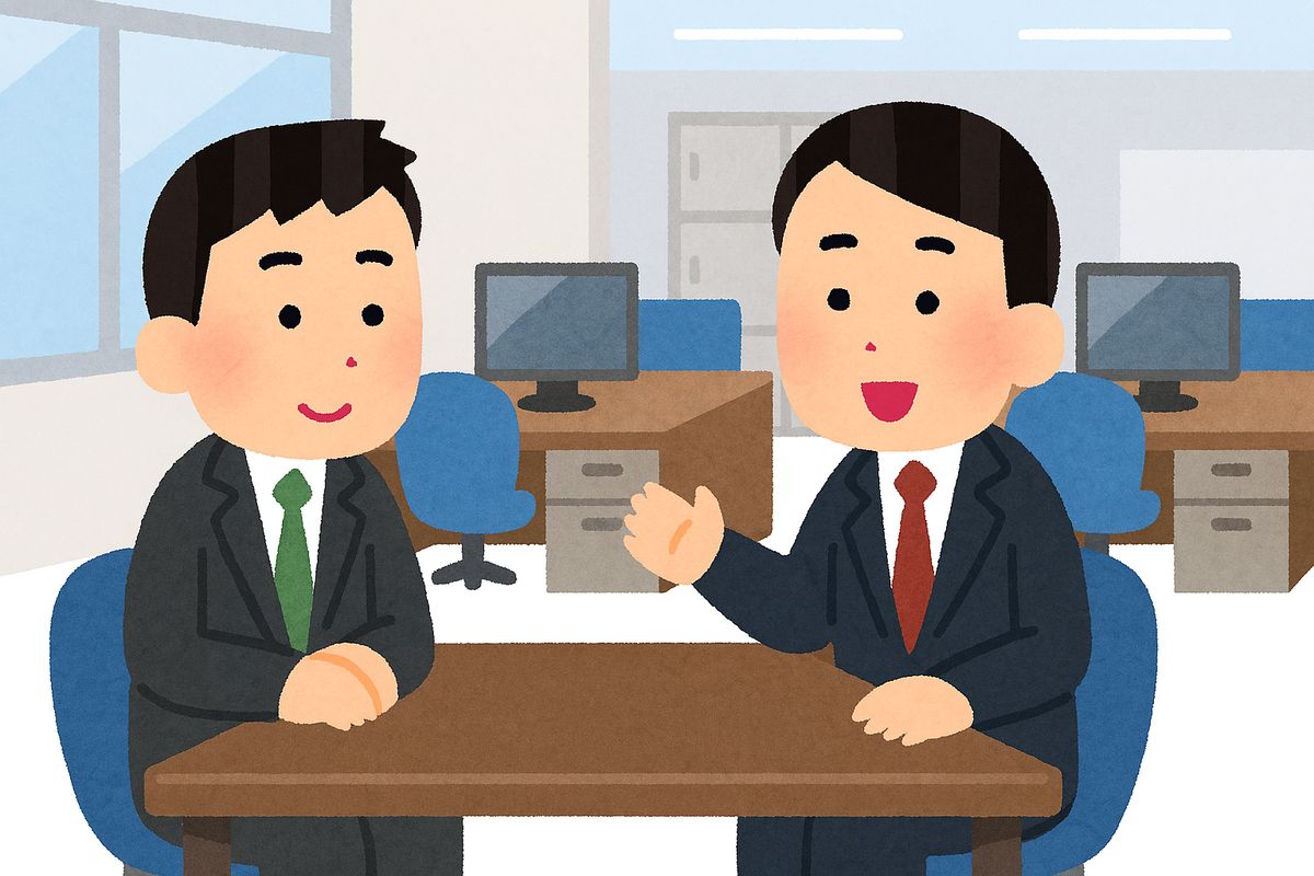 オフィスで1on1をしているビジネスマン