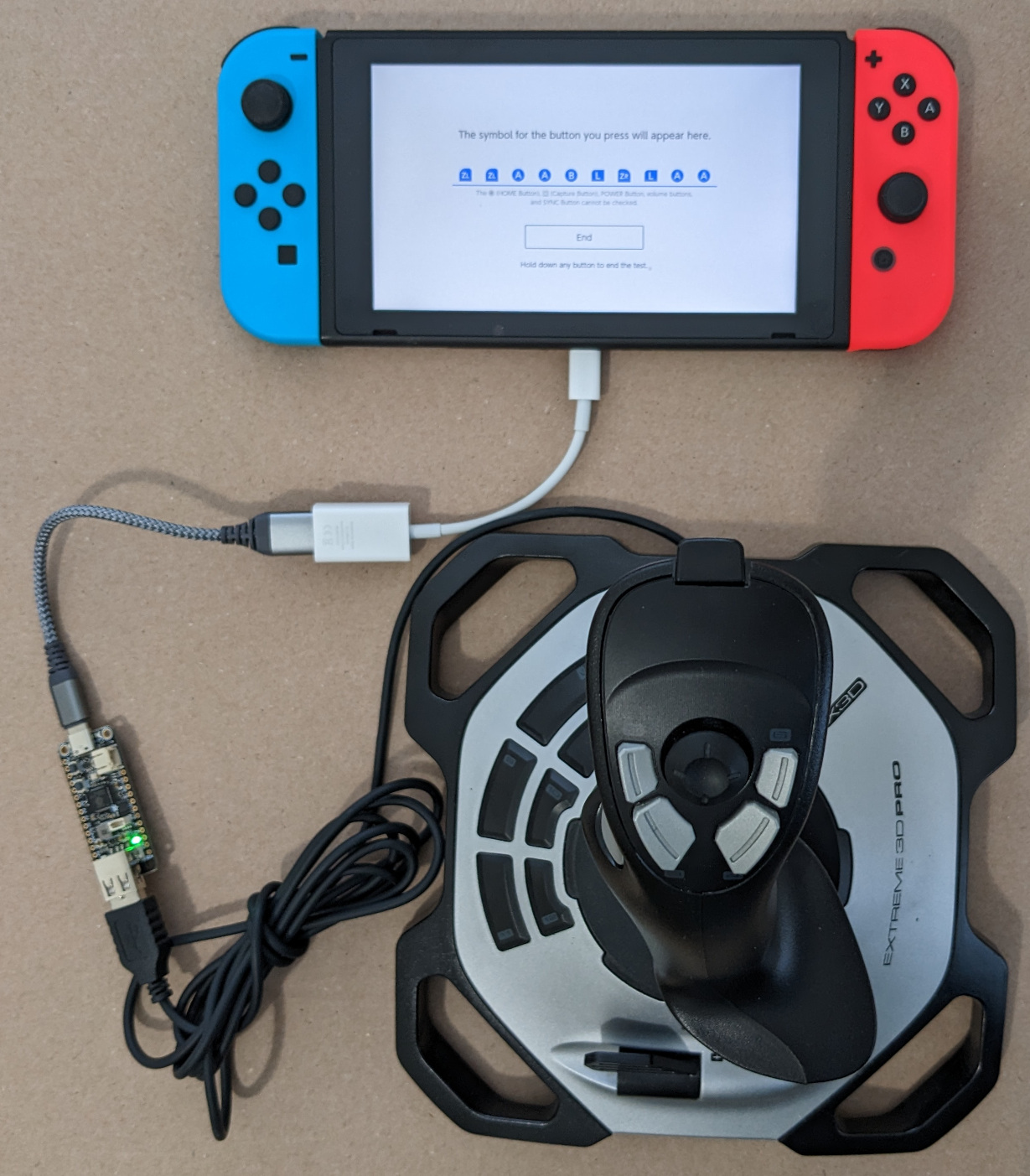 Nintendo Switch connected to RP2040 Feather connected to joystick