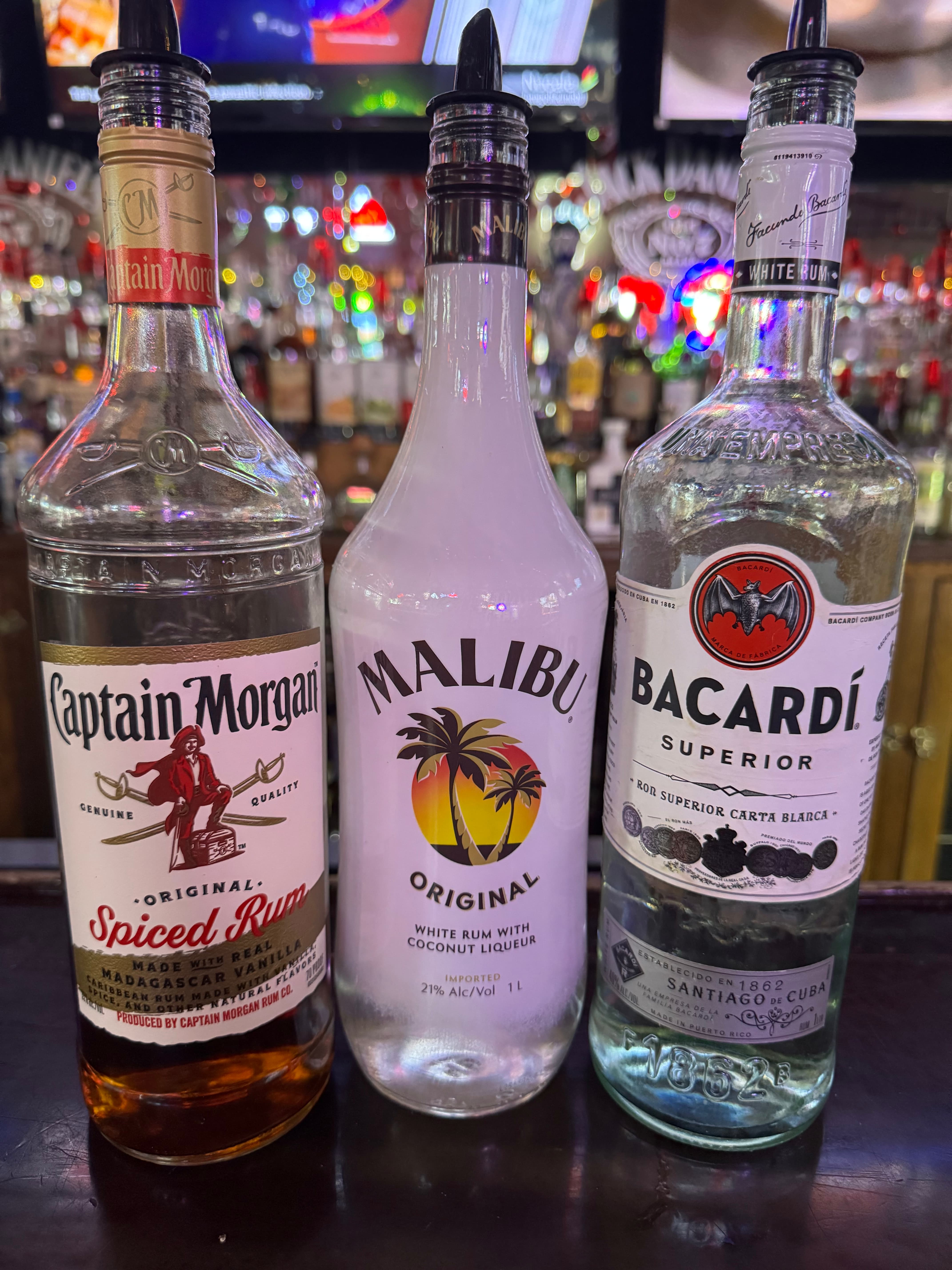Captain Morgan Bacardi Malibu rum bottles