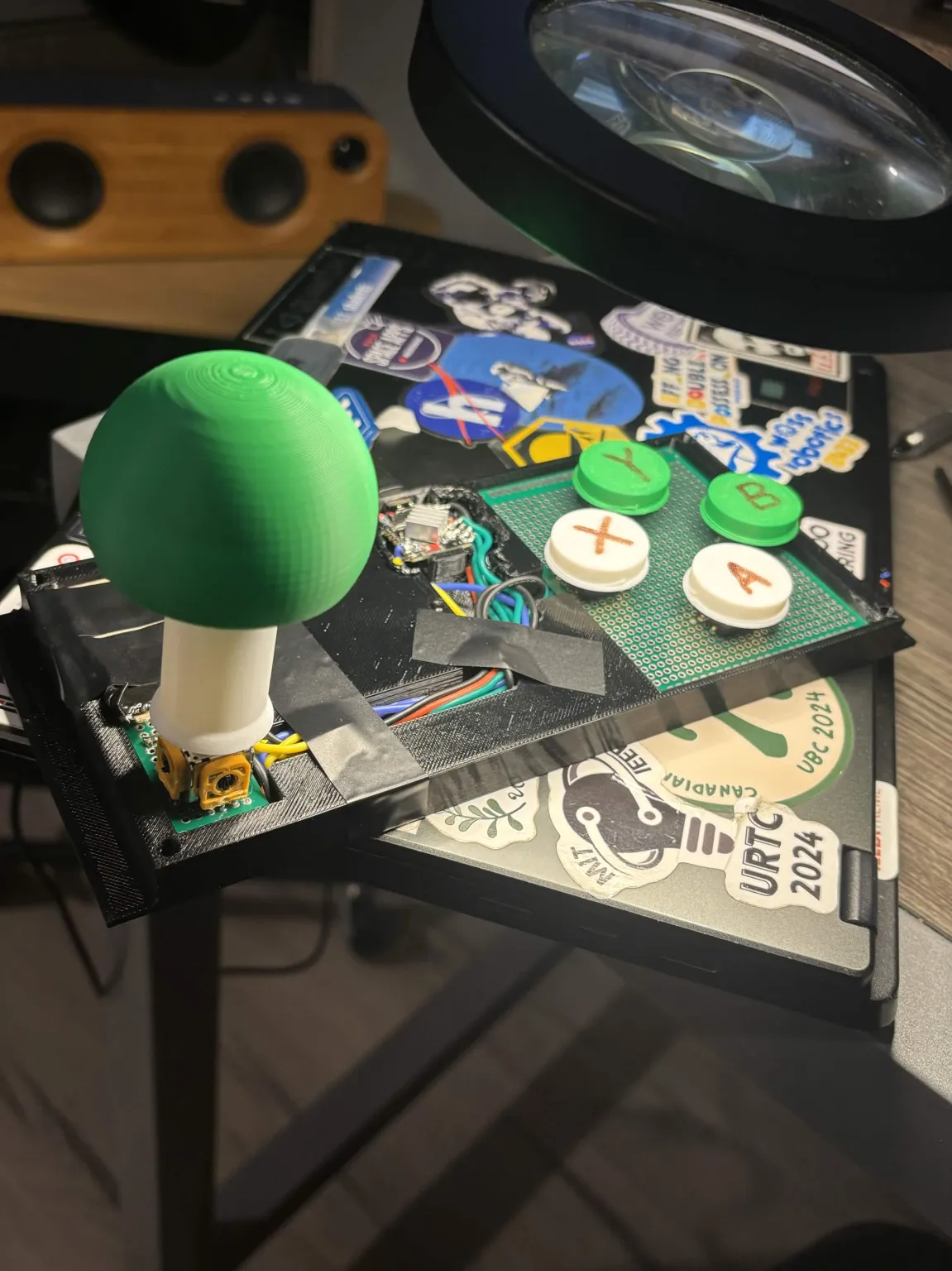Our custom joystick and four button controller
