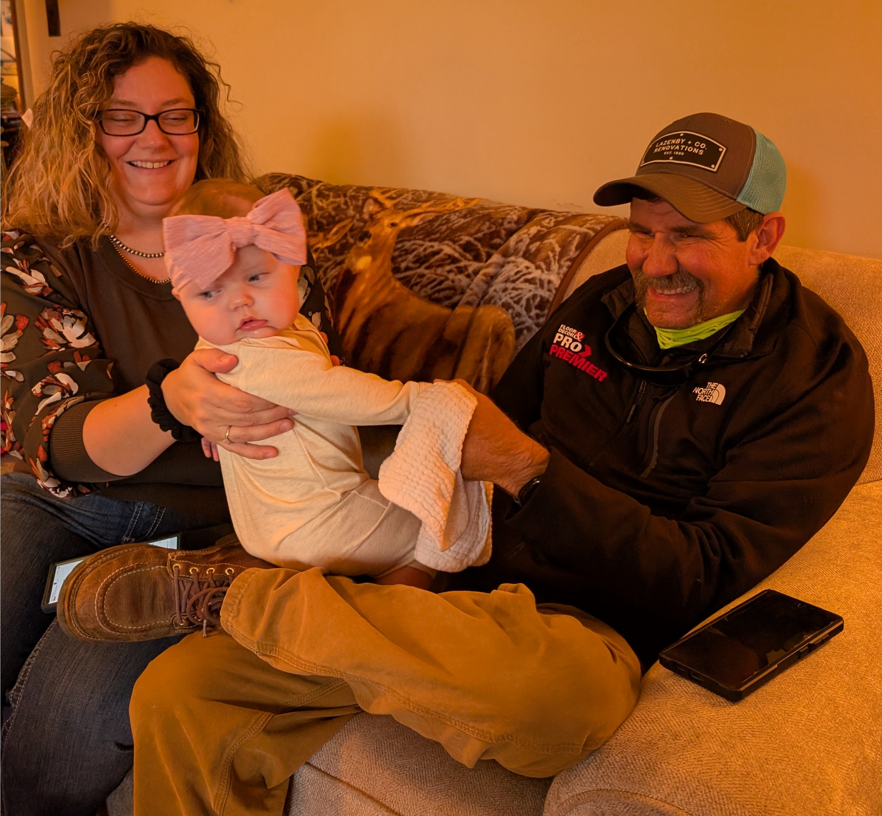 Adam enjoying his 6 month old niece with Sarah Lazenby