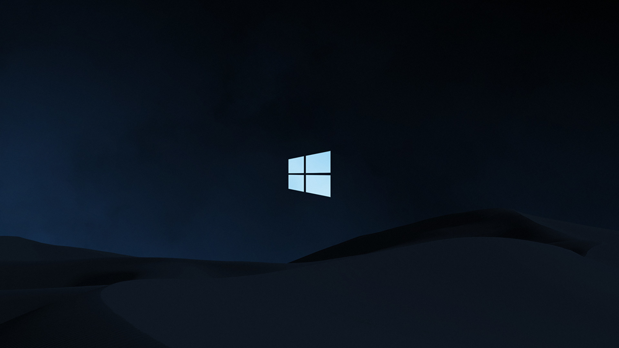 sand dunes at night with windows logo