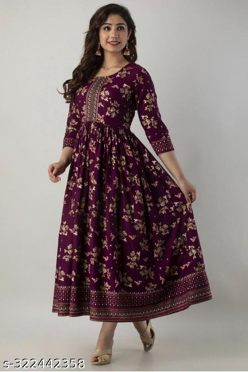 A wine Anarkali border print kurti with tassels sounds like a beautiful and stylish outfit choice Anarkali style kurtas are known for their flowing and flared silhouette, which adds an elegant touch to your look.Charvi Superior Kurtis - ARYAMI
