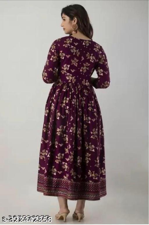 A wine Anarkali border print kurti with tassels sounds like a beautiful and stylish outfit choice Anarkali style kurtas are known for their flowing and flared silhouette, which adds an elegant touch to your look.Charvi Superior Kurtis - ARYAMI