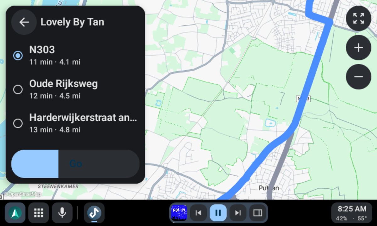 Coffee shops near you in Vela Maps, with the music player beside the map