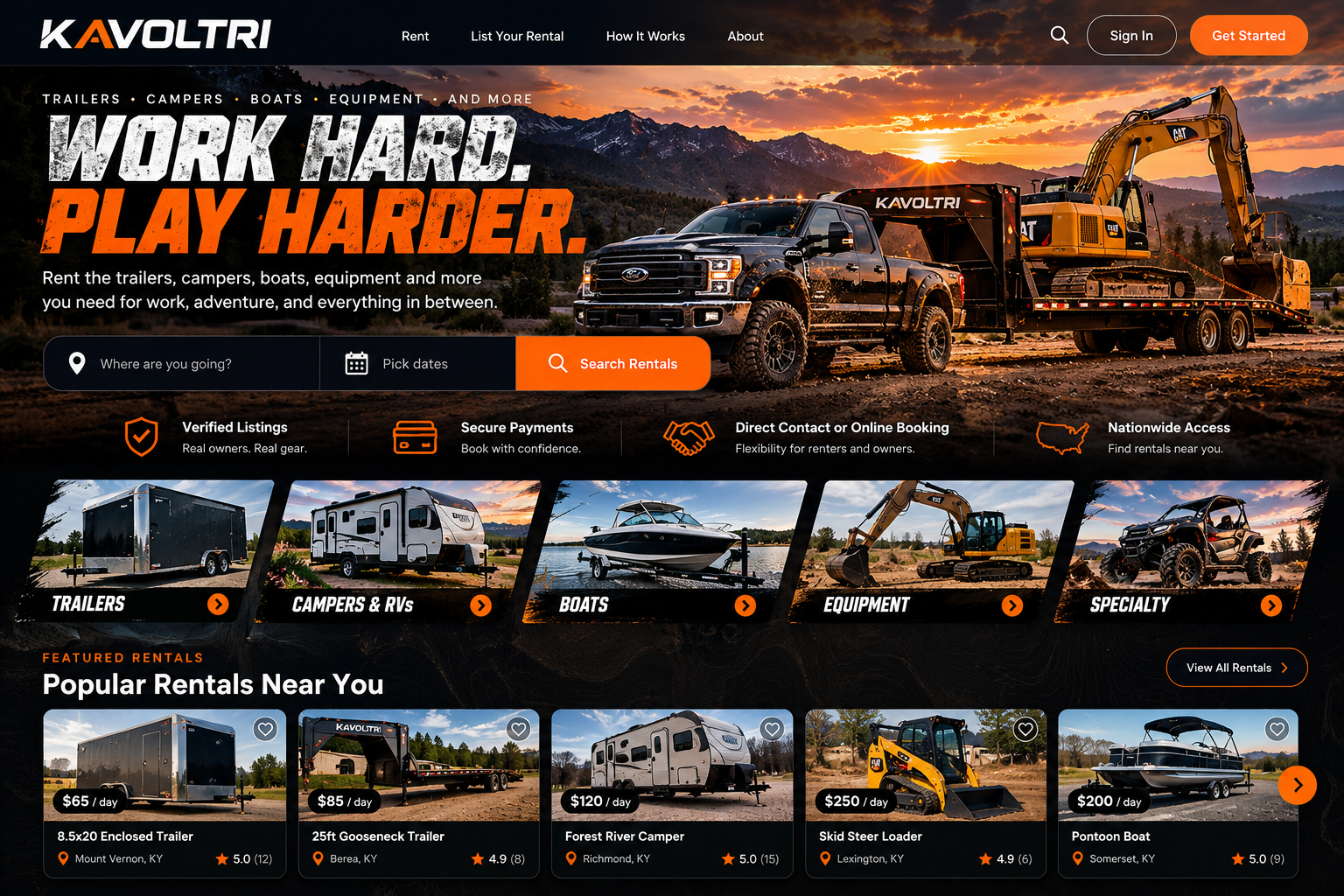 Black heavy-duty truck hauling an excavator on a trailer against a mountain sunset