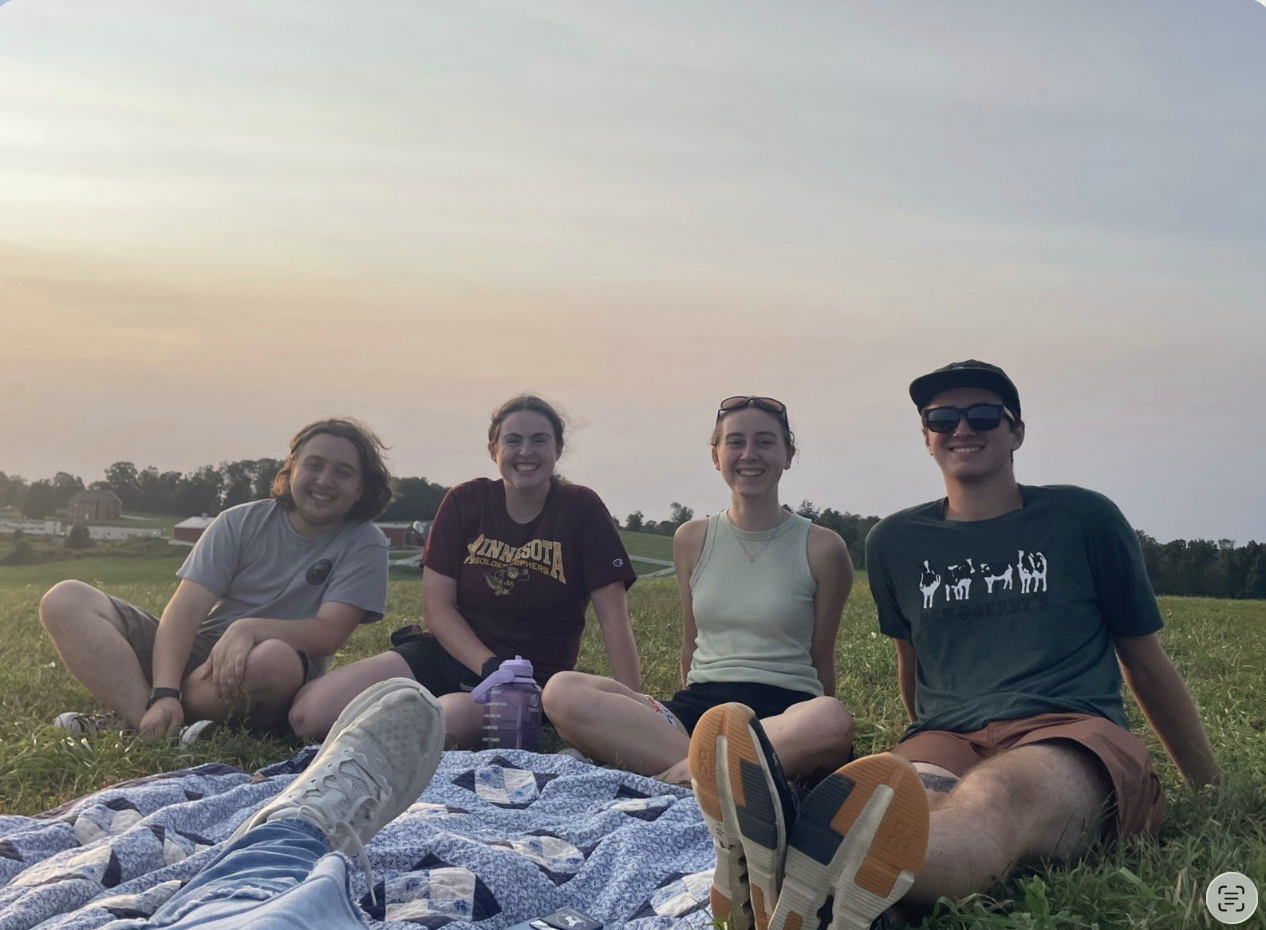 Brothers relaxing on a blanket at Horsebarn Hill