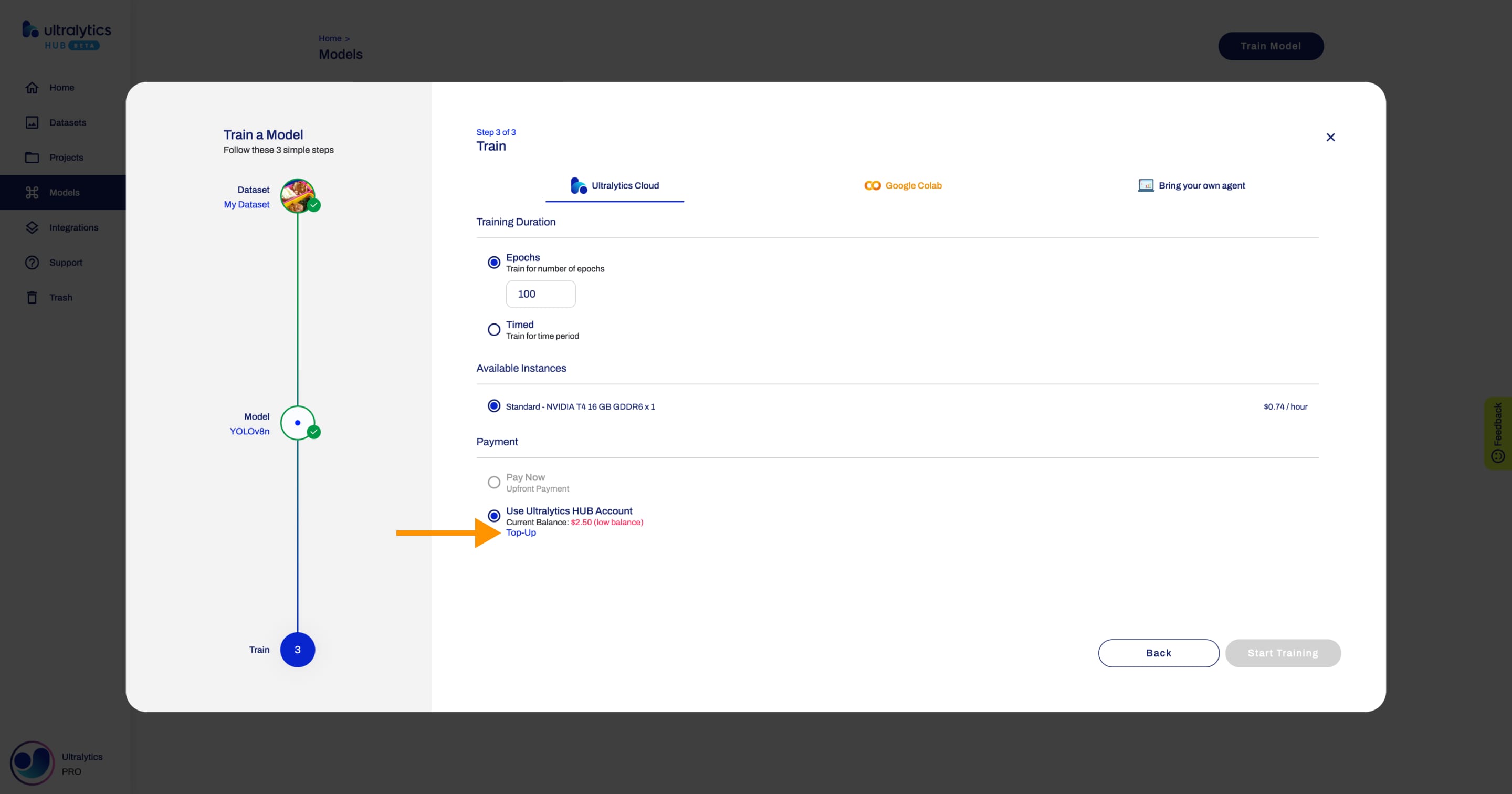 Ultralytics HUB screenshot of the Train Model dialog with an arrow pointing to the Top-Up button