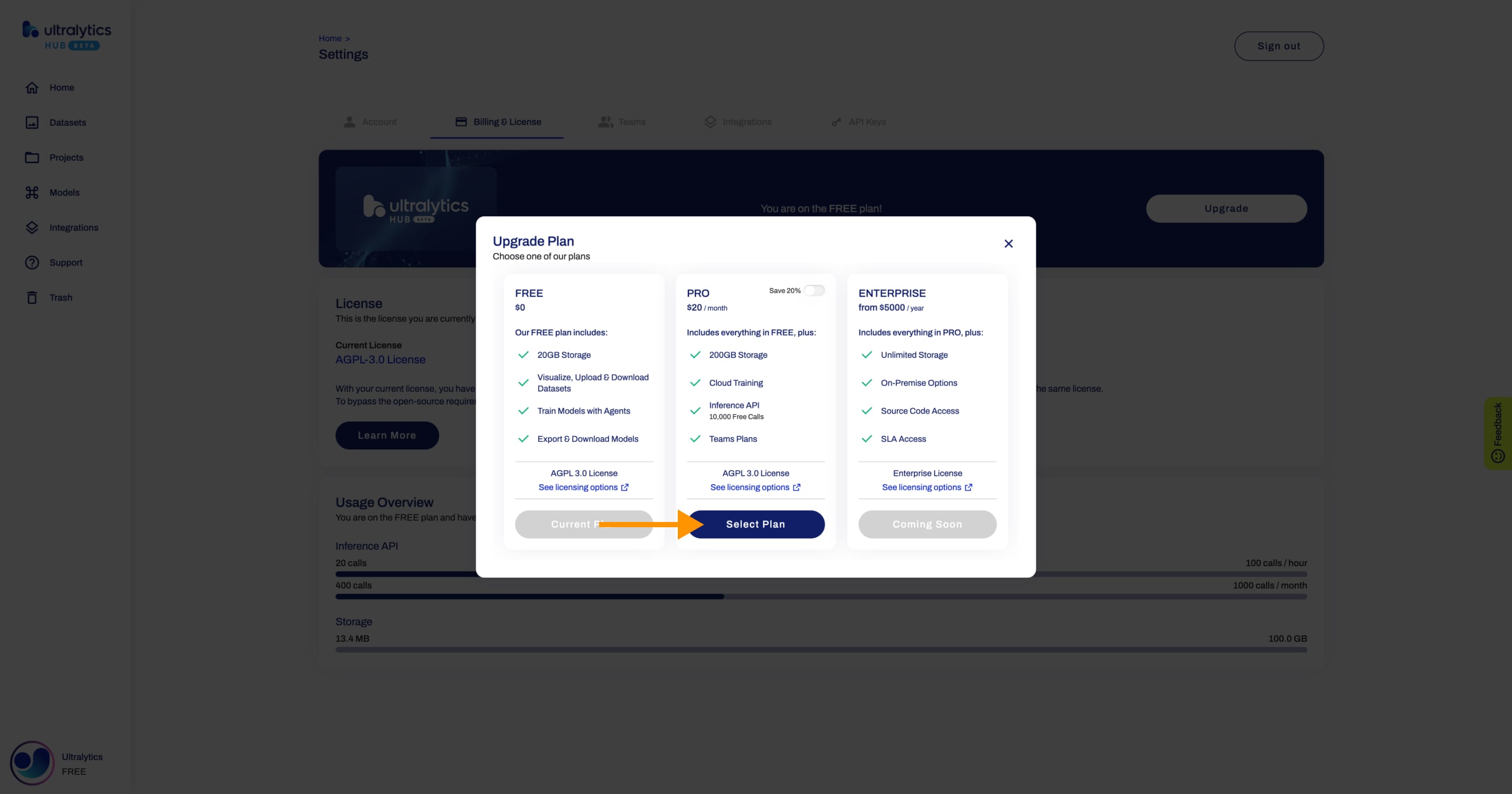 Ultralytics HUB screenshot of the Upgrade dialog with an arrow pointing to the Select Plan button