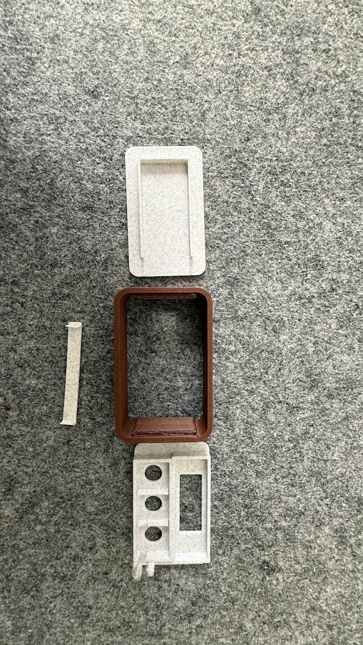 3D-printed enclosure parts laid out