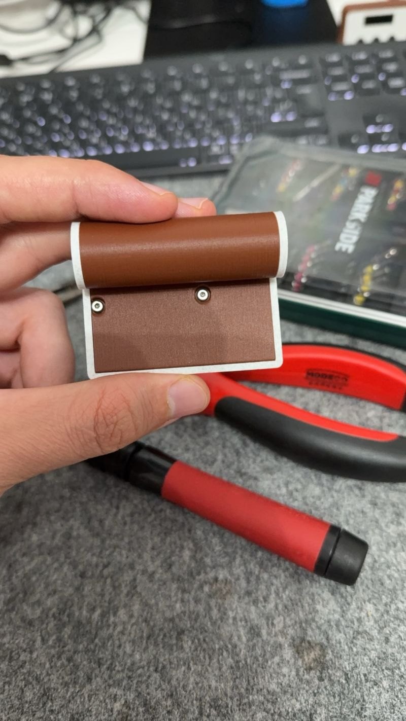 The back of the printed enclosure — a cylindrical tube for the 14500 cell and a screwed-on base plate