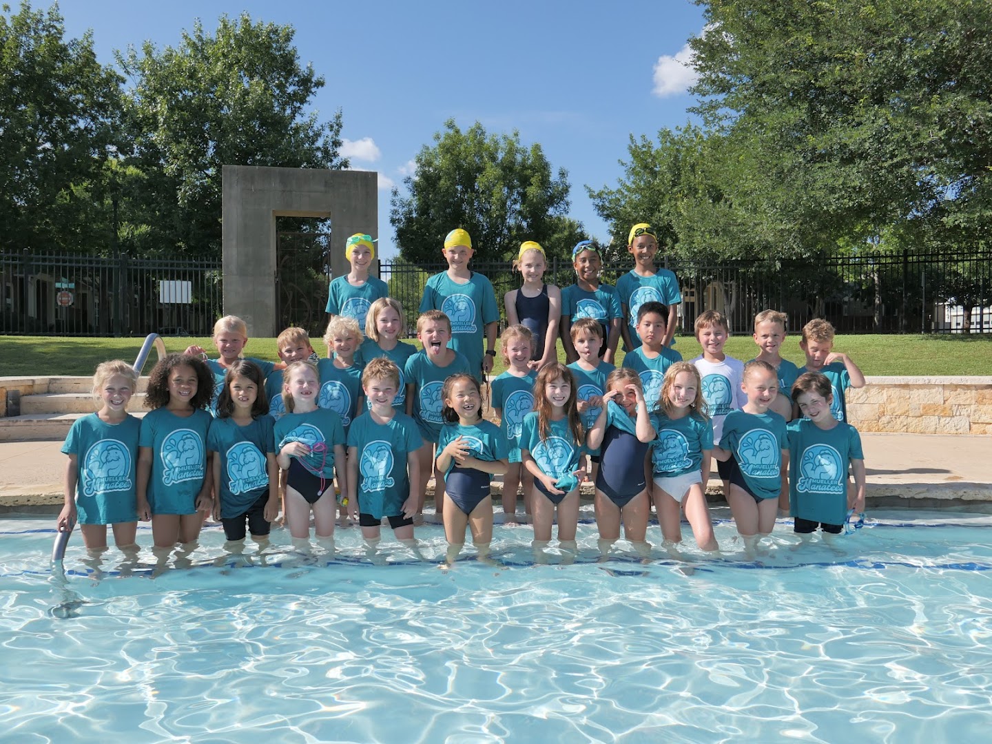 Mueller Manatees swimmers smiling together after a swim.