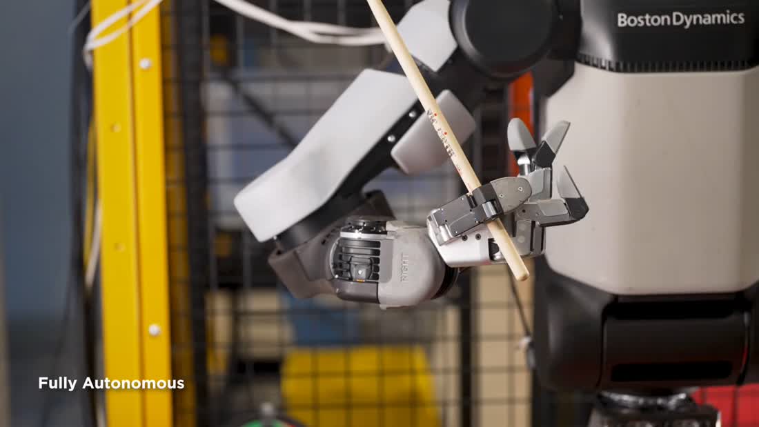 Official Atlas video frame labeled Fully Autonomous while manipulating a wooden stick