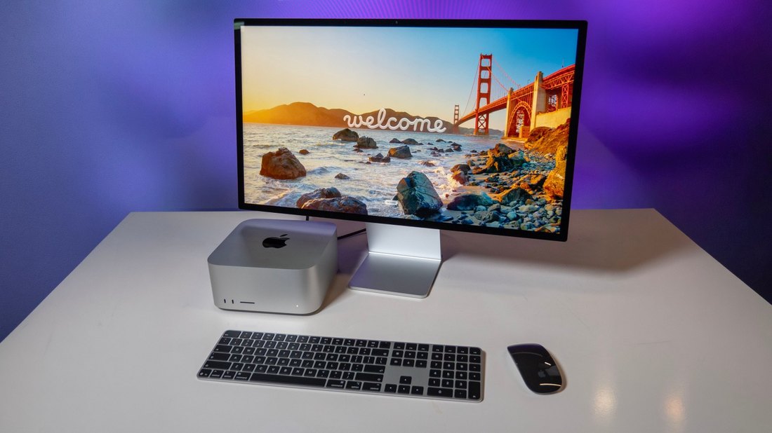 Mac Studio with Studio Display, Magic Keyboard and Magic Mouse on a desk during setup