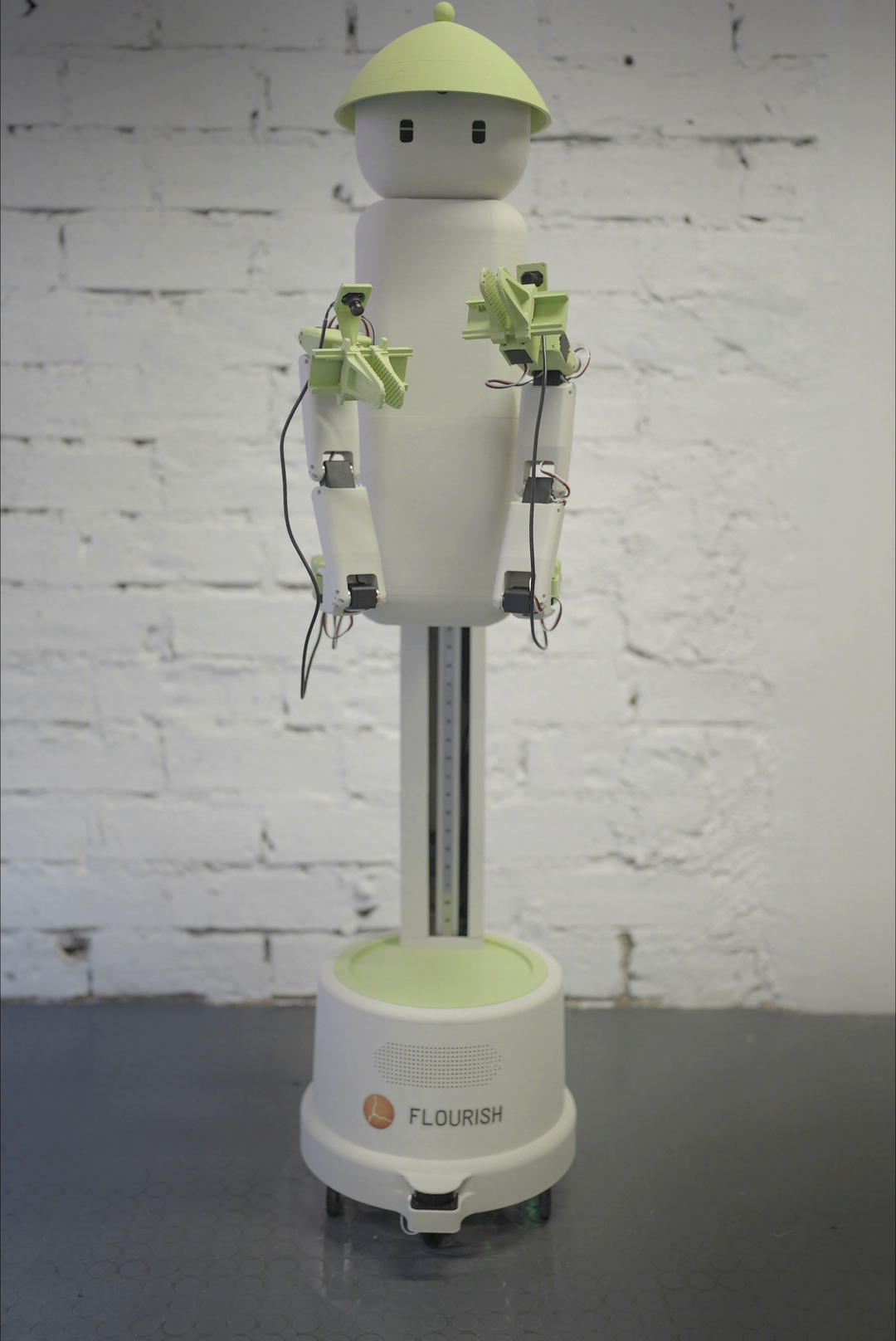 Front view of Flourish 1 showing its column, two arms and wheeled base