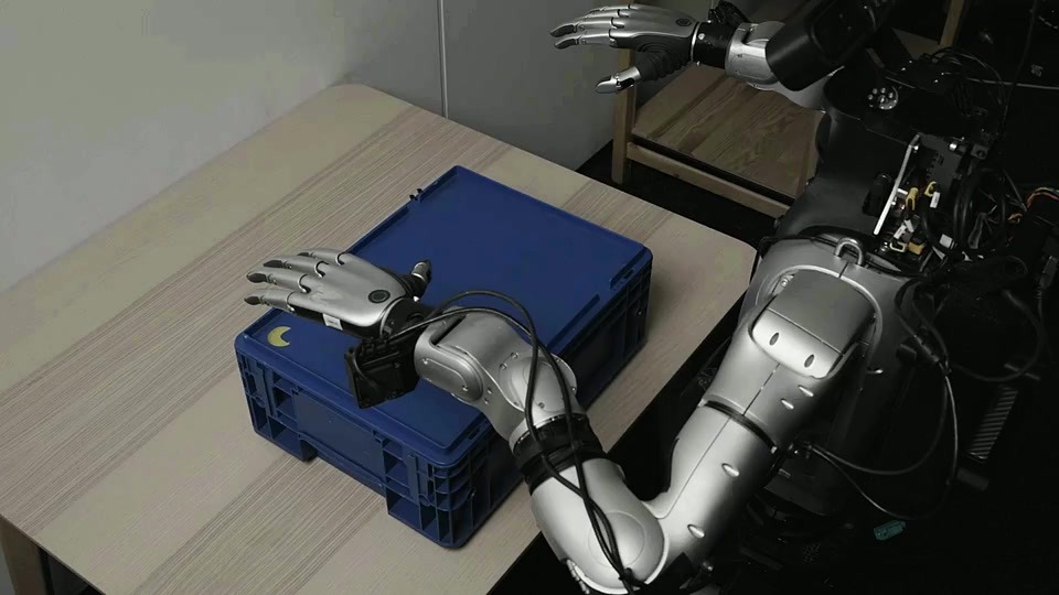 Official humanoid demo poster showing robotic hands beside a blue container