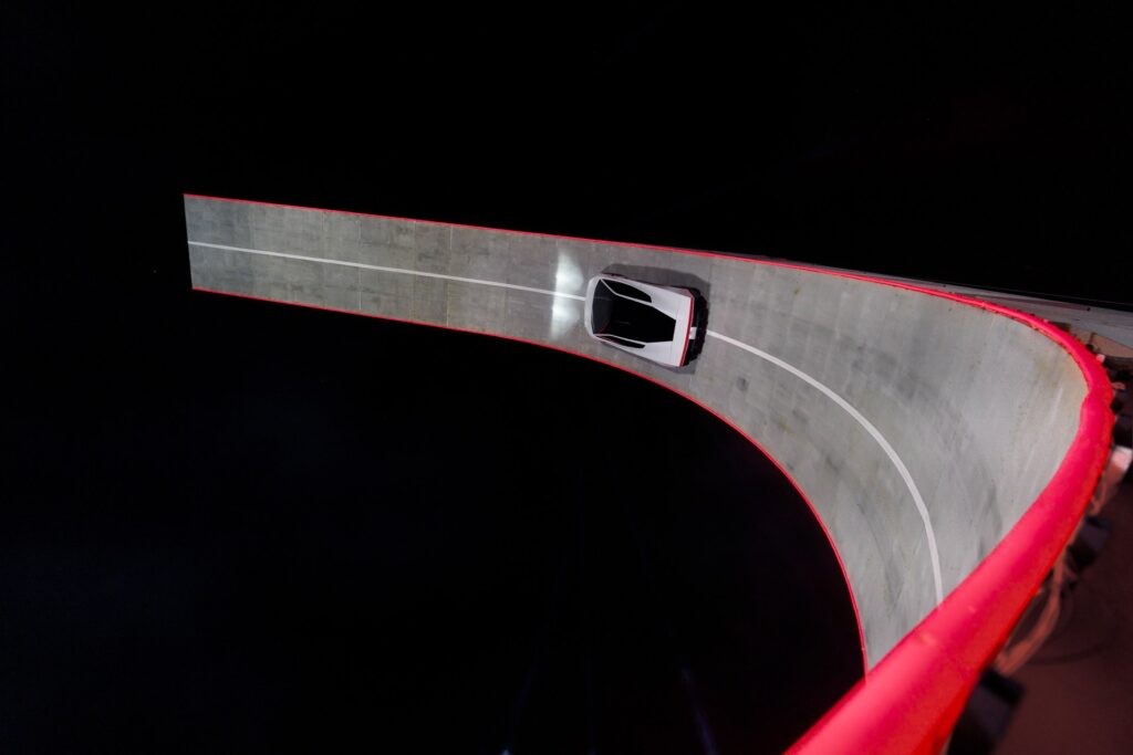 Roadster following the curved ramp, seen from above