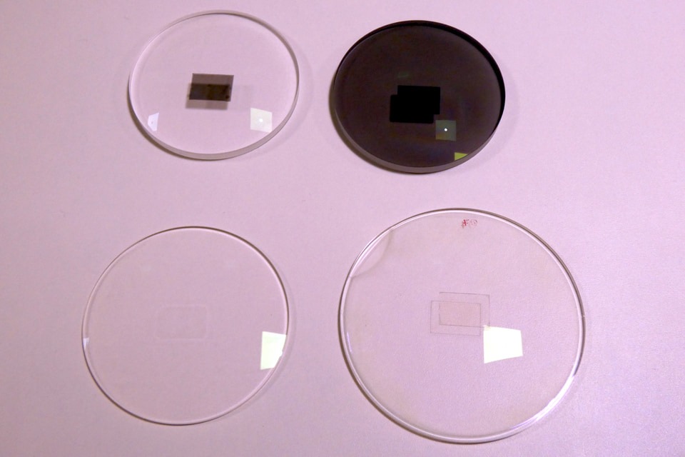 Transparent circular mirror samples on a display at the TDK press presentation