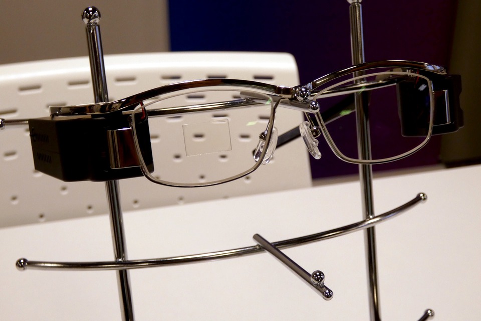 Physical retinal projection glasses prototype photographed at the TDK press presentation
