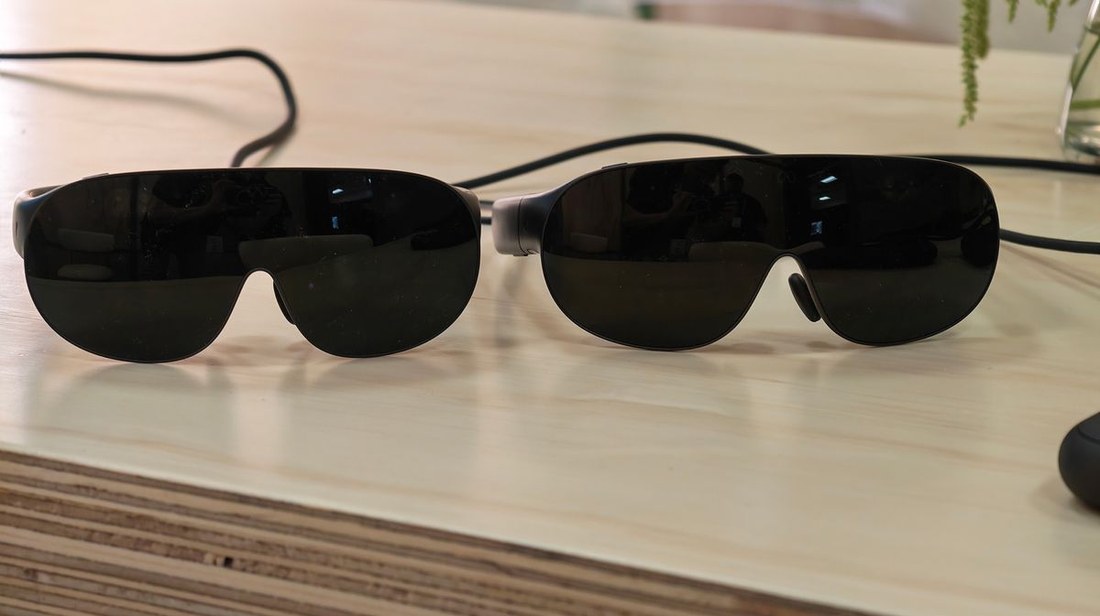 Two Meta VR Glasses units, Standard and Large, side by side on a table
