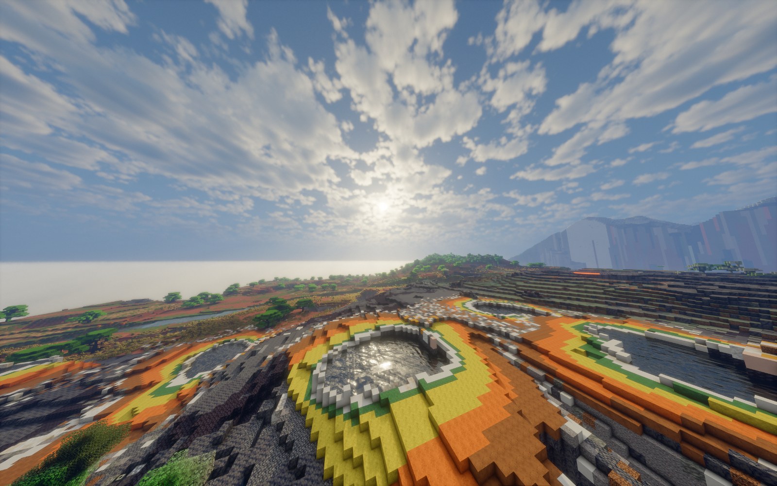 A hot spring with orange and yellow microbial mats