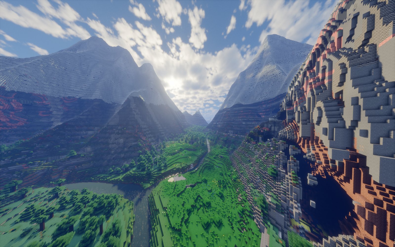 A river valley between snowy peaks