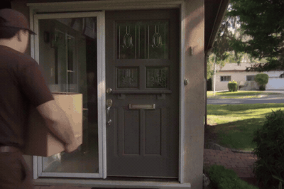 Eros Max, a delivery driver at a front door