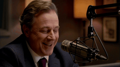 A radio host greets the listeners at the microphone