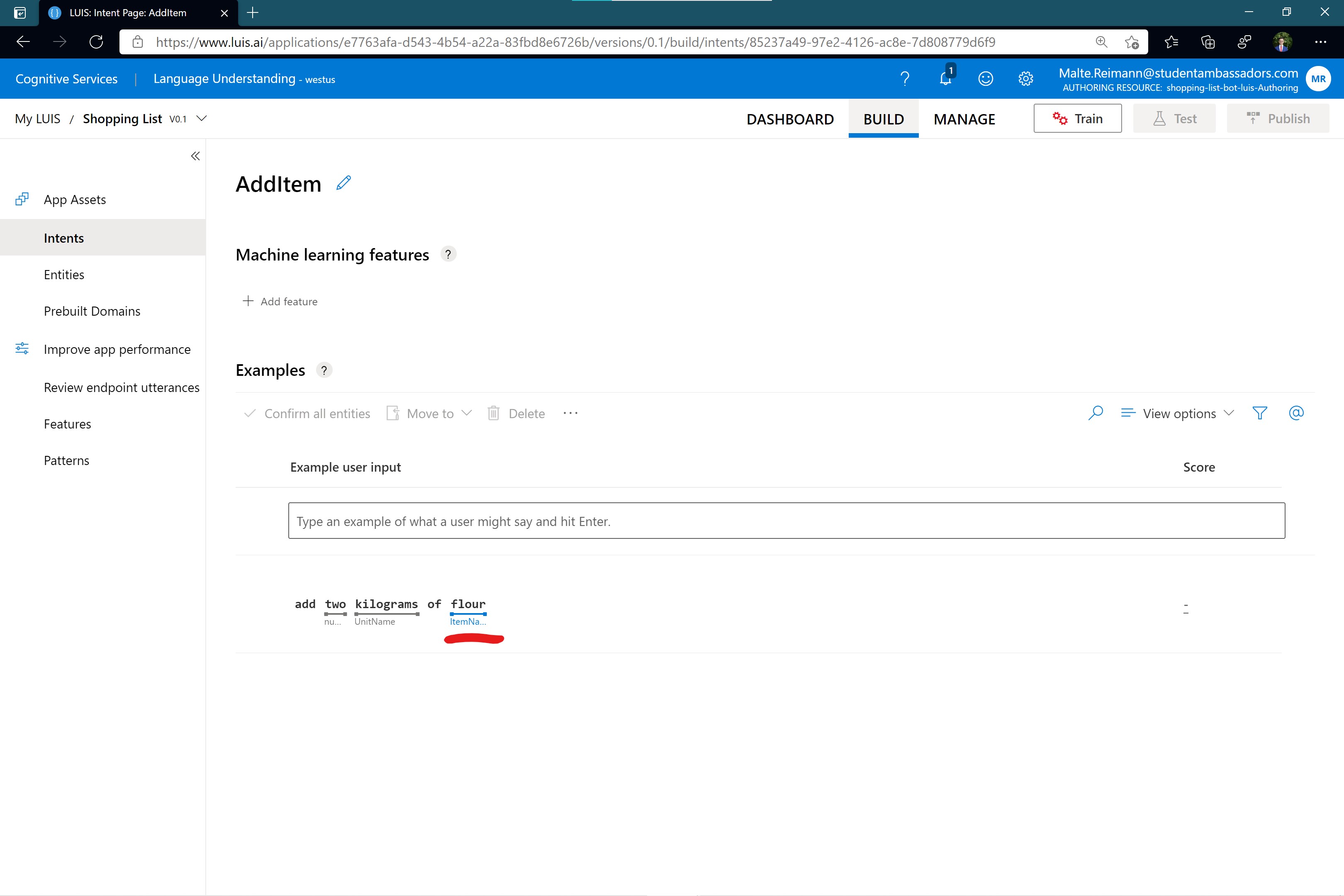 Screenshot of luis.ai 'AddItem' intent page with word 'flour' in example sentence marked as an entity of type 'ItemName'