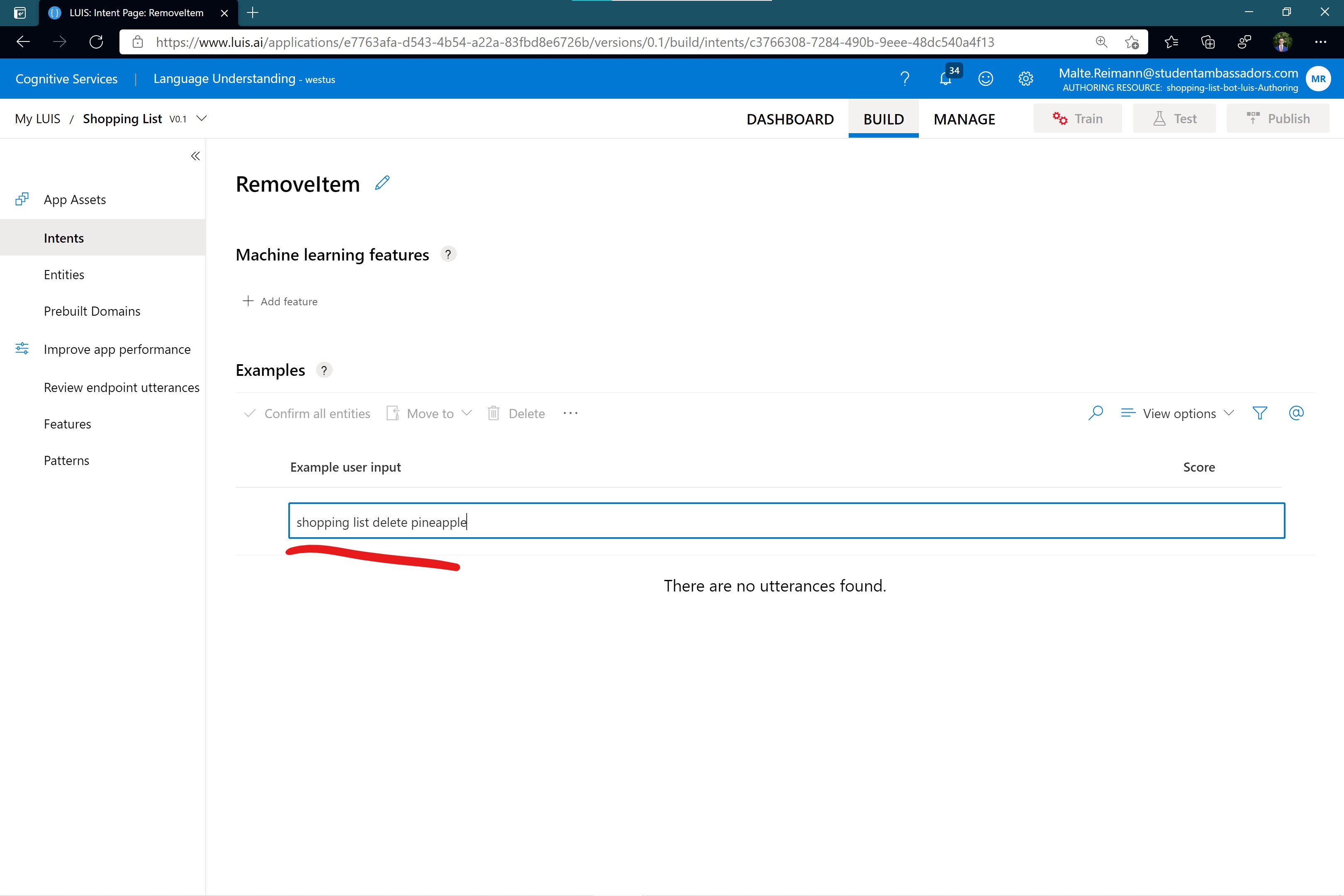 Screenshot of luis.ai 'RemoveItem' intent page with 'shopping list delete pineapple' typed in as an example user input.