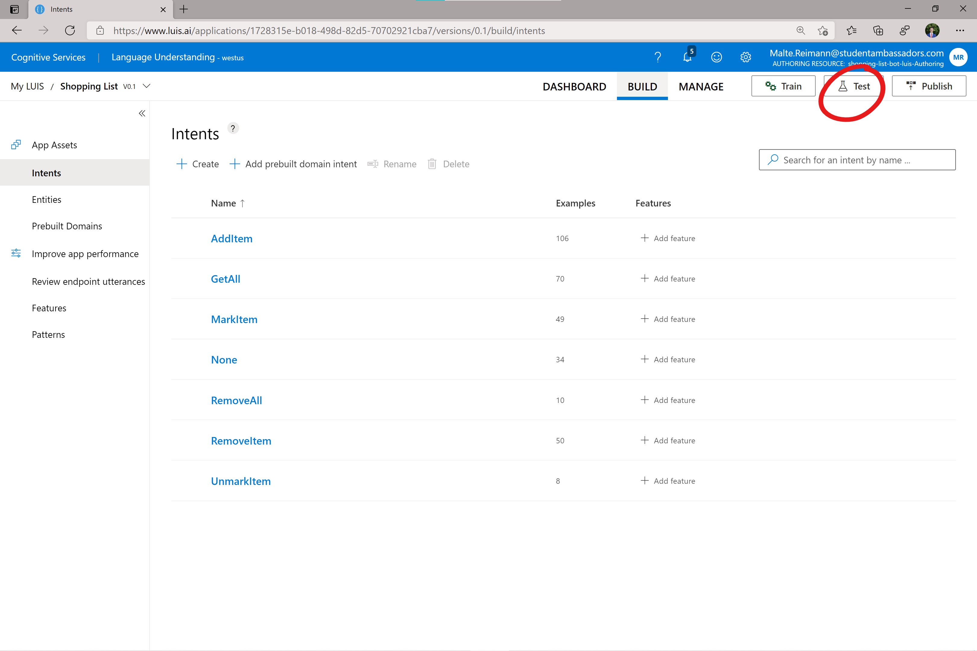 Screenshot of luis.ai intents page with a red circle around 'Test' button.