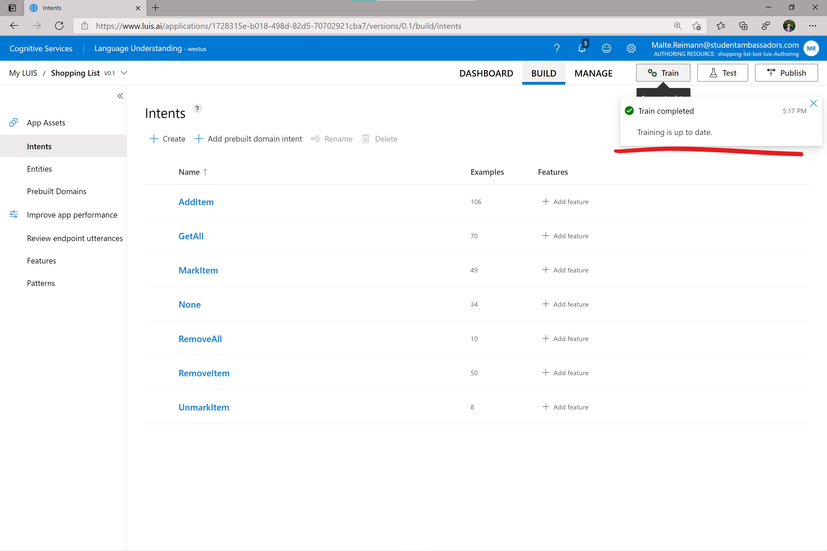 Screenshot of luis.ai with 'Train completed' notification
