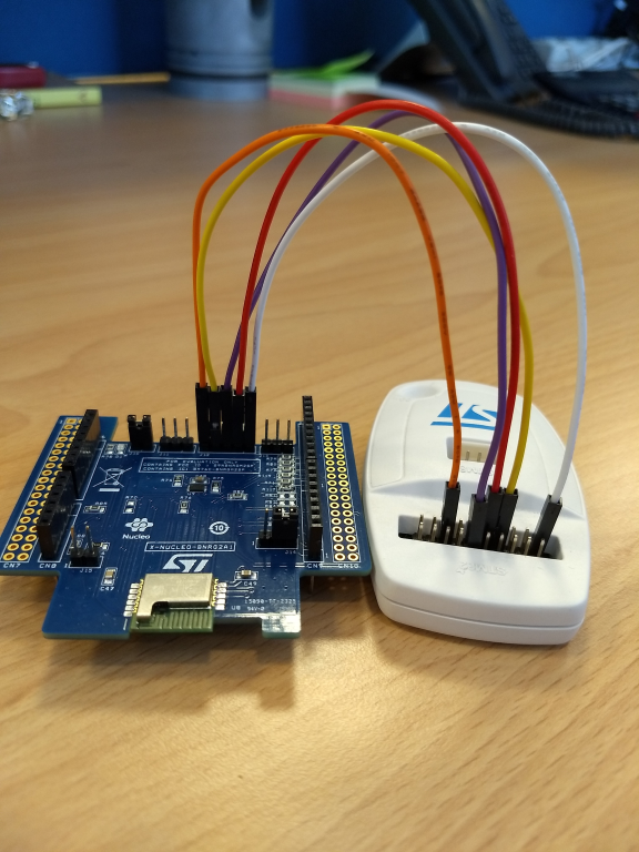 "Connection among the J12 pins of the X-NUCLEO-BNRG2A1 and the ST-Link V2-1"