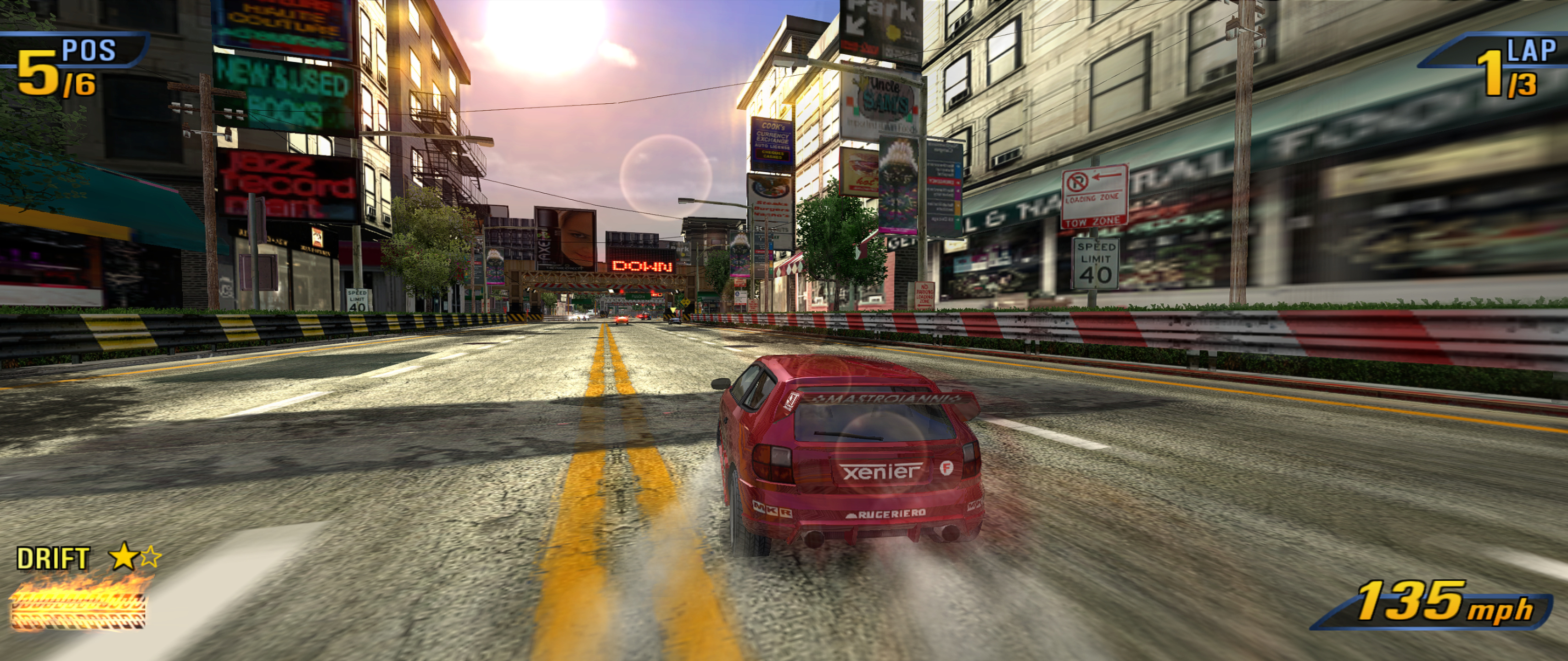 A race at 21:9 through a town street at sunset: buildings on both sides fill the whole width, with the displays at the far left and right edges