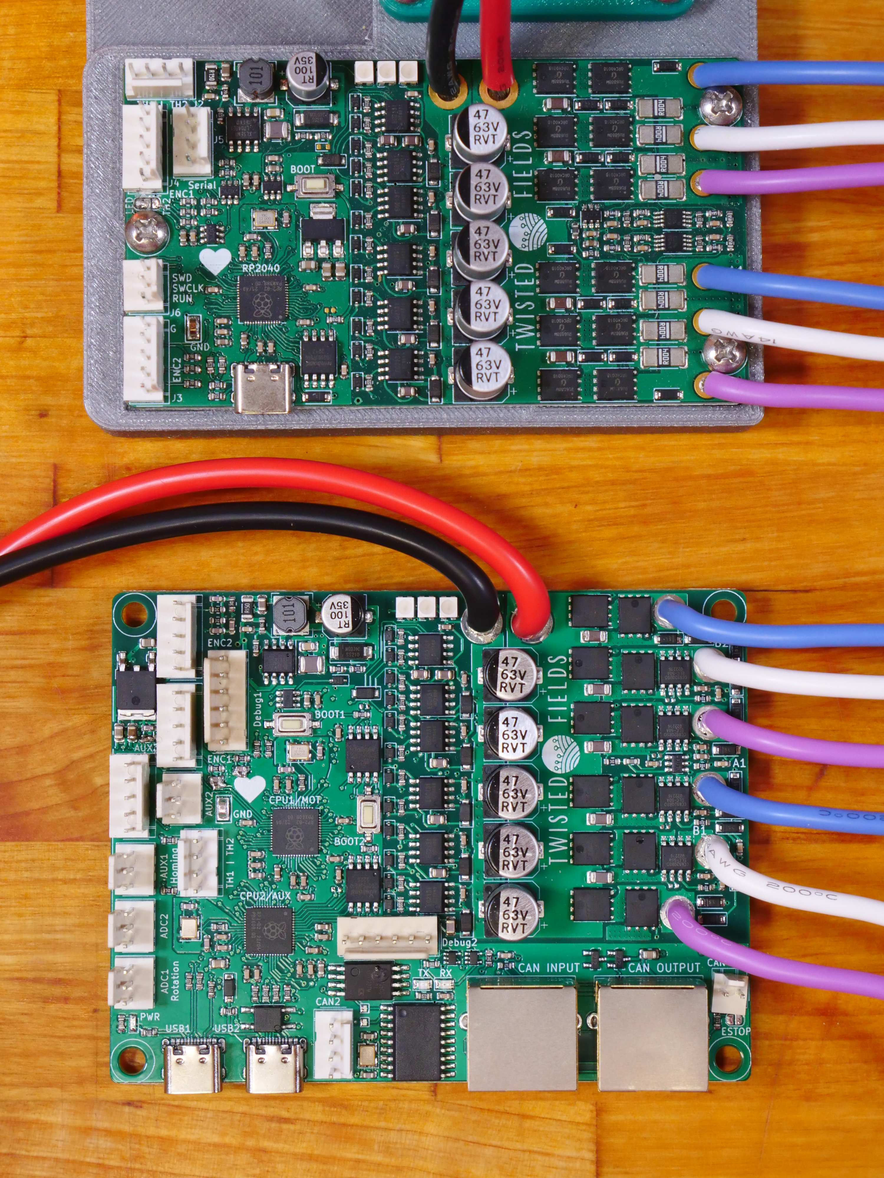 A photo of both PCB designs