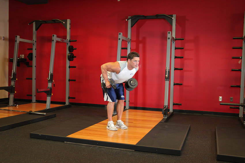 Standing Bent-Over Two-Arm Dumbbell Triceps Extension reference position 1