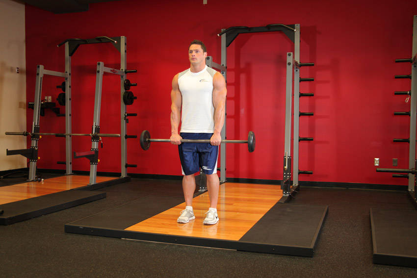 Standing Front Barbell Raise Over Head reference position 1