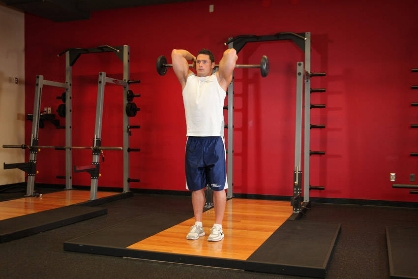 Standing Overhead Barbell Triceps Extension reference position 1