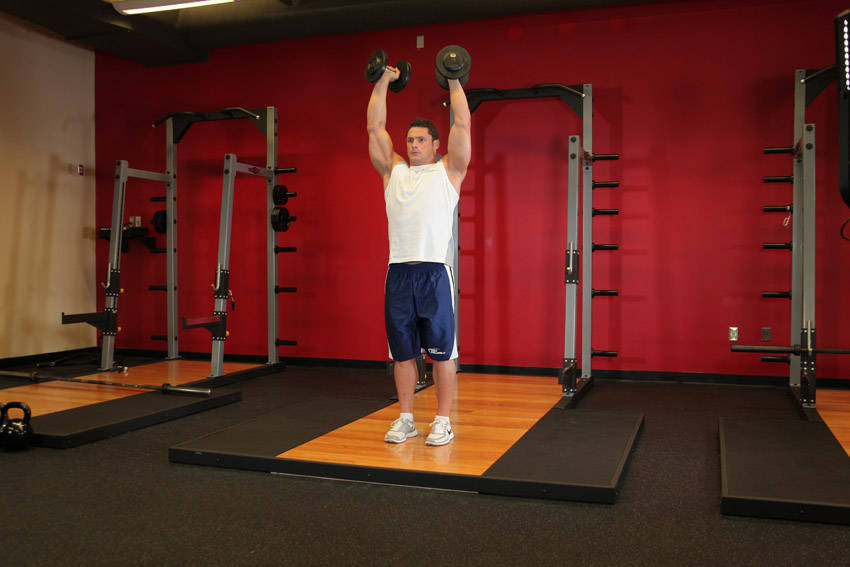 Standing Palms-In Dumbbell Press reference position 1