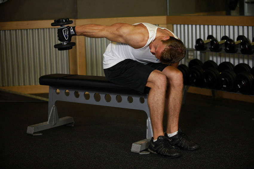 Ending position of Seated Bent-Over One-Arm Dumbbell Triceps Extension