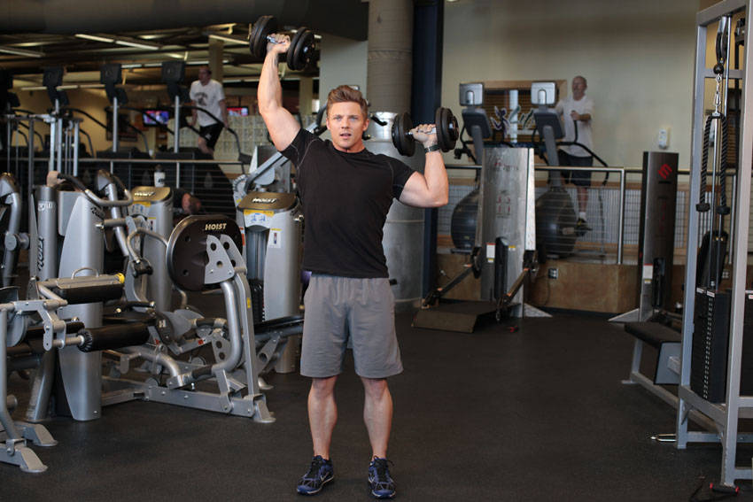 Ending position of Standing Alternating Dumbbell Press