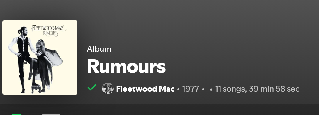Album page header with a listened badge at the start of the artist and release line