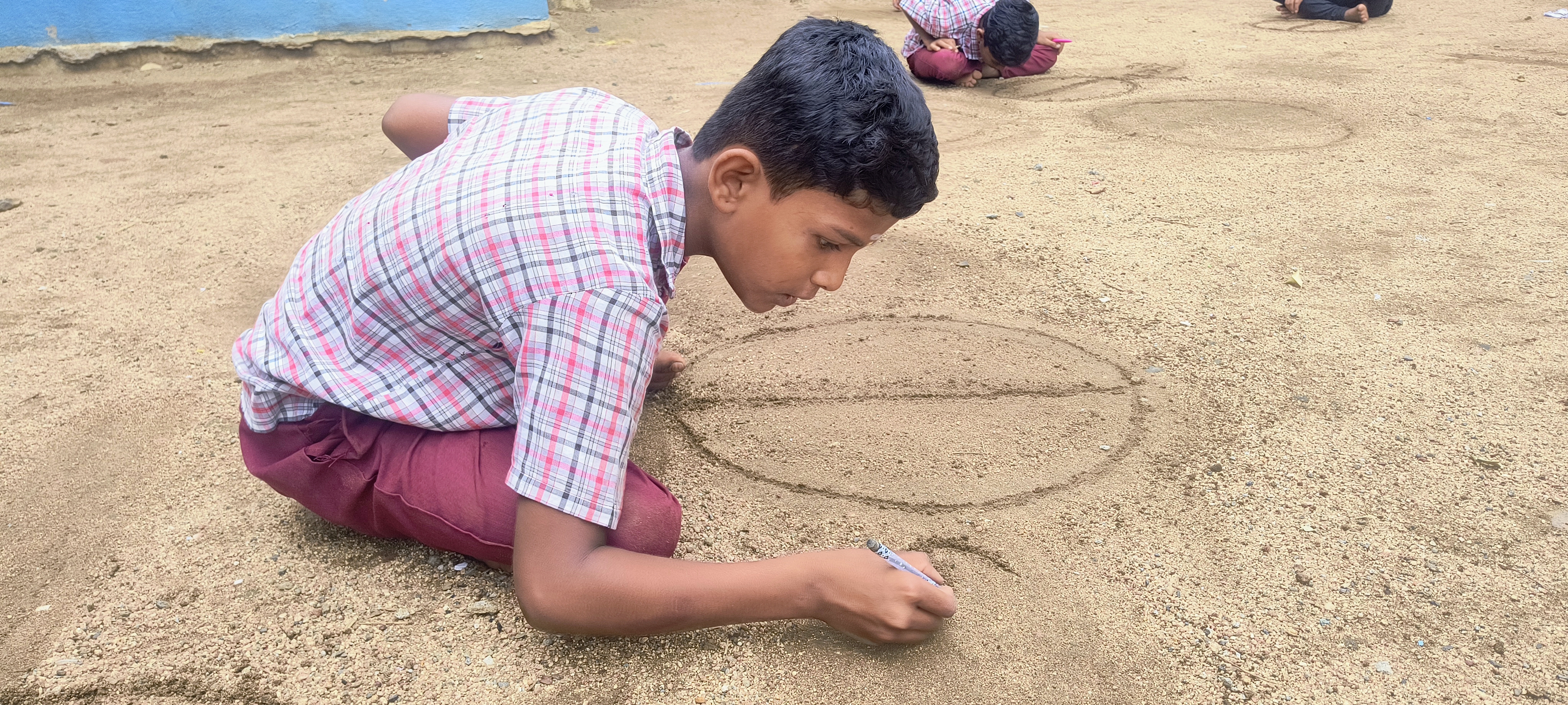 A student painting on a canvas.